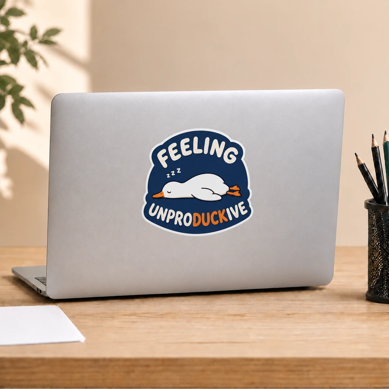 Feeling Unproductive Duck Sticker, Navy Nap design shown on a laptop lid