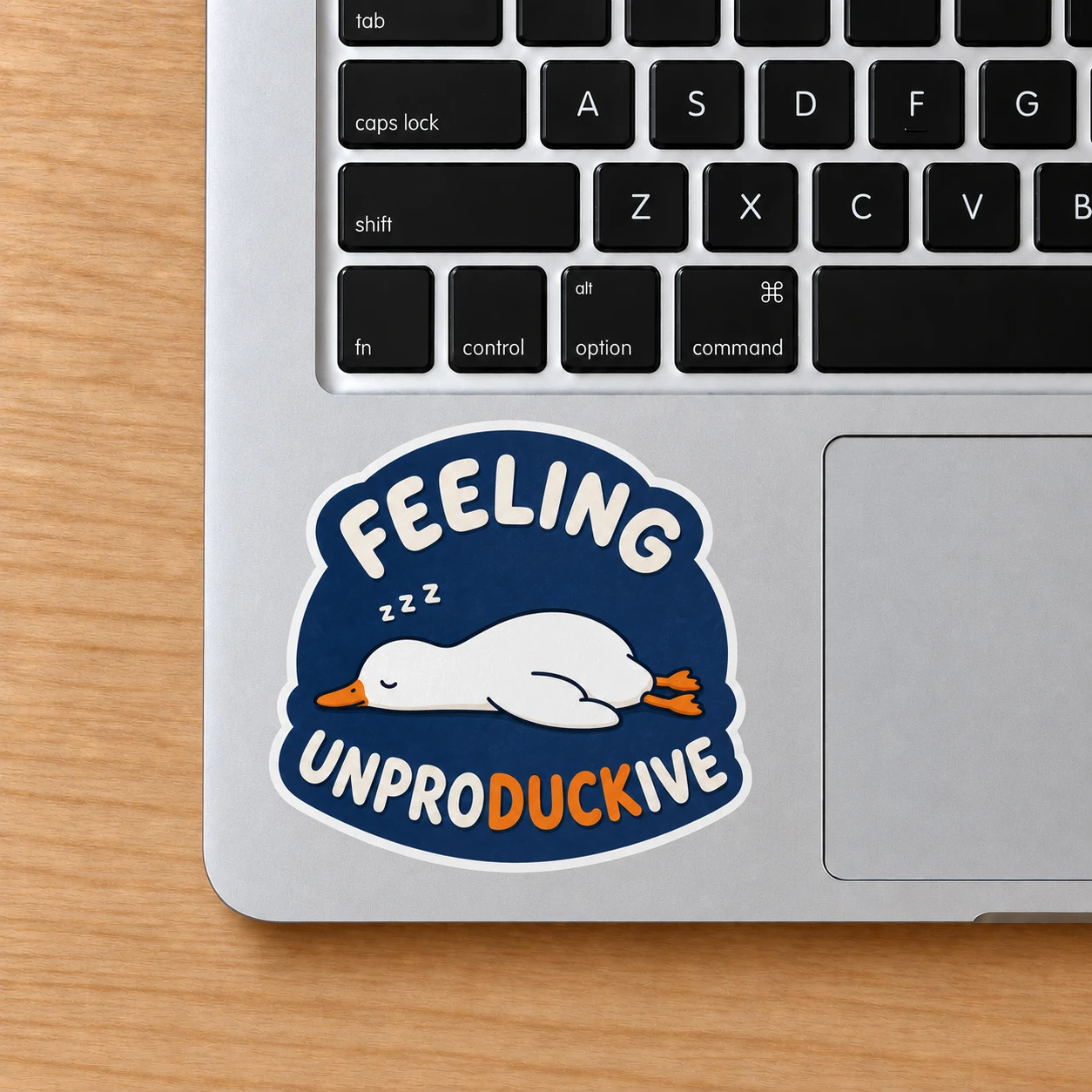 Feeling Unproductive Duck Sticker, Navy Nap design shown on a laptop palm rest
