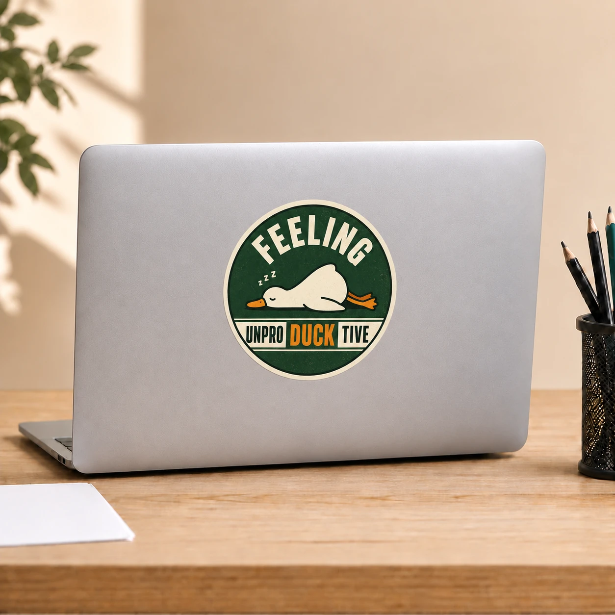 Feeling Unproductive Duck Sticker, Vintage Green design shown on a laptop lid