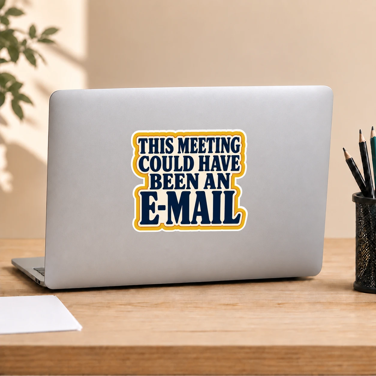 This Meeting Could Have Been an E-Mail Sticker, Bold Type design shown on a laptop lid