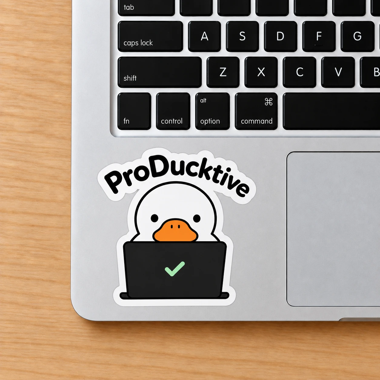 ProDucktive Sticker, Task Duck design shown on a laptop palm rest