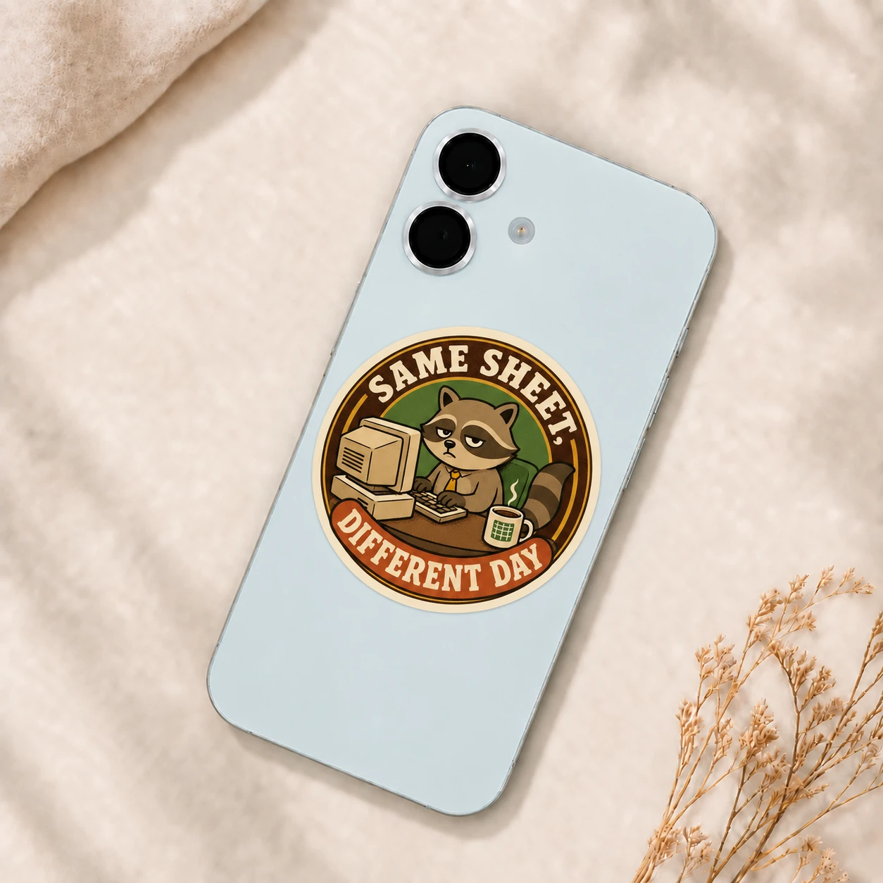 Same Sheet, Different Day Sticker, Vintage Badge design shown on a phone