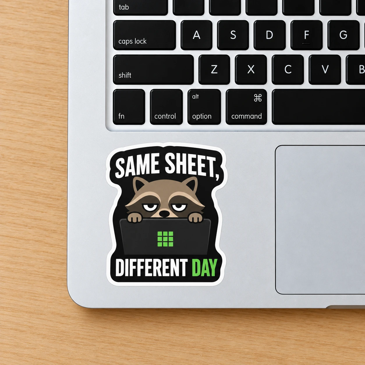 Same Sheet, Different Day Sticker, Laptop Peek design shown on a laptop palm rest