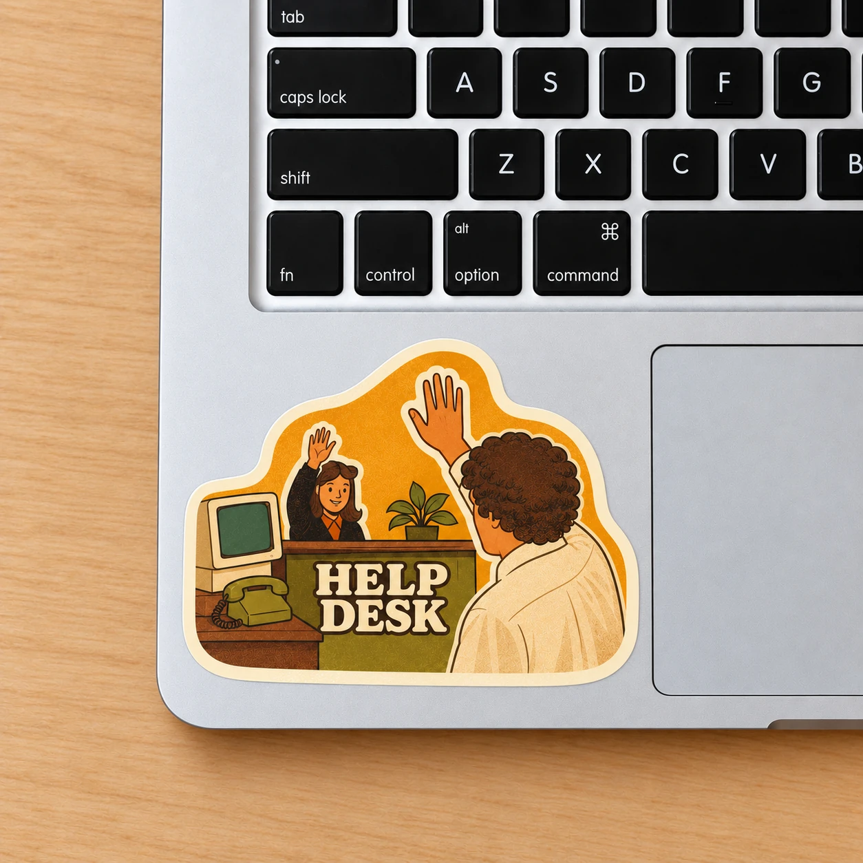 Help Desk Sticker, High Five design shown on a laptop palm rest