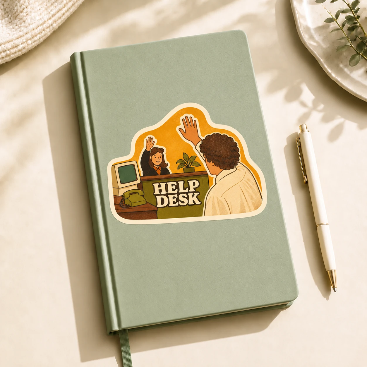 Help Desk Sticker, High Five design shown on a notebook