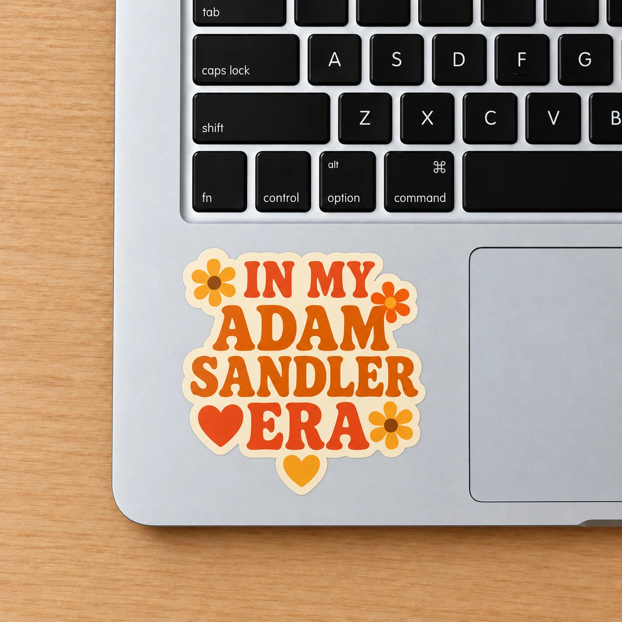 In My Adam Sandler Era Sticker, Retro Flowers design shown on a laptop palm rest
