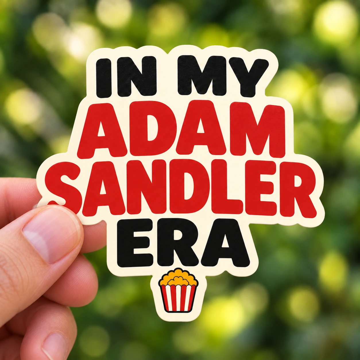 In My Adam Sandler Era Sticker, Movie Popcorn design shown held in a hand