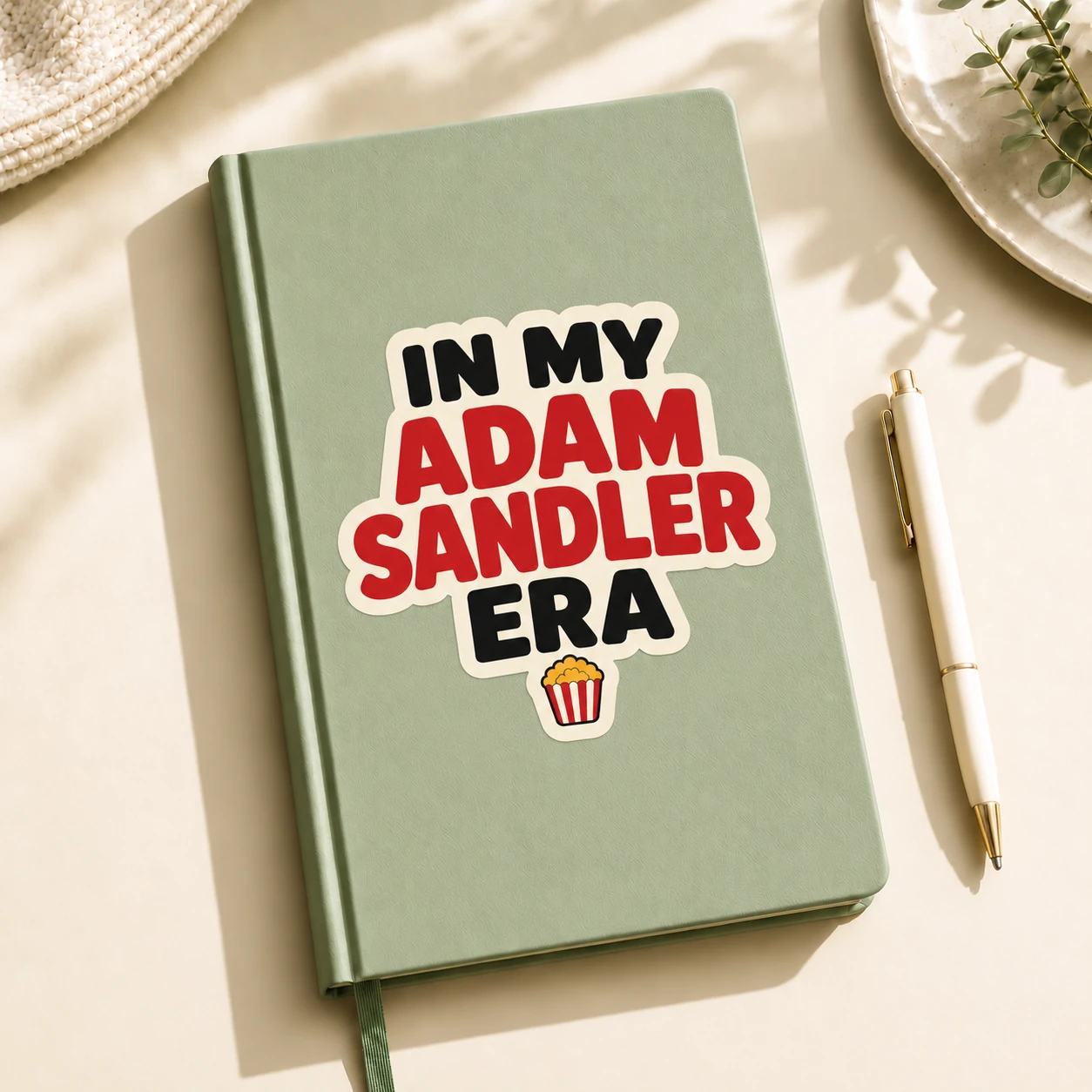 In My Adam Sandler Era Sticker, Movie Popcorn design shown on a notebook
