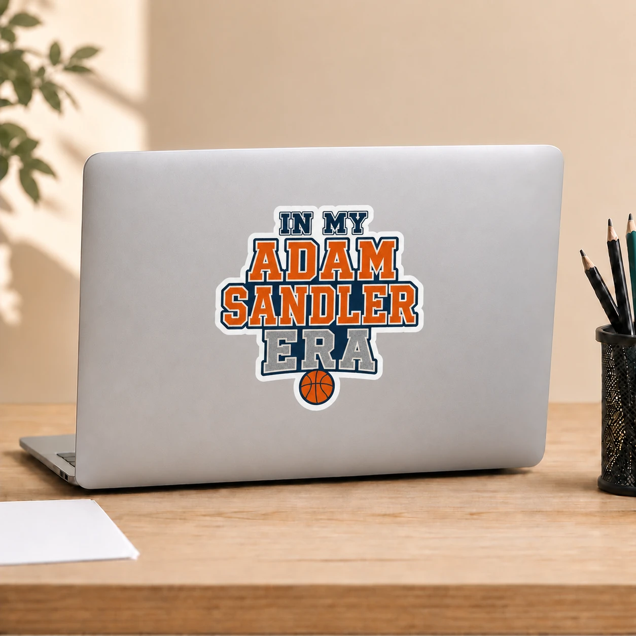 In My Adam Sandler Era Sticker, Varsity Basketball design shown on a laptop lid