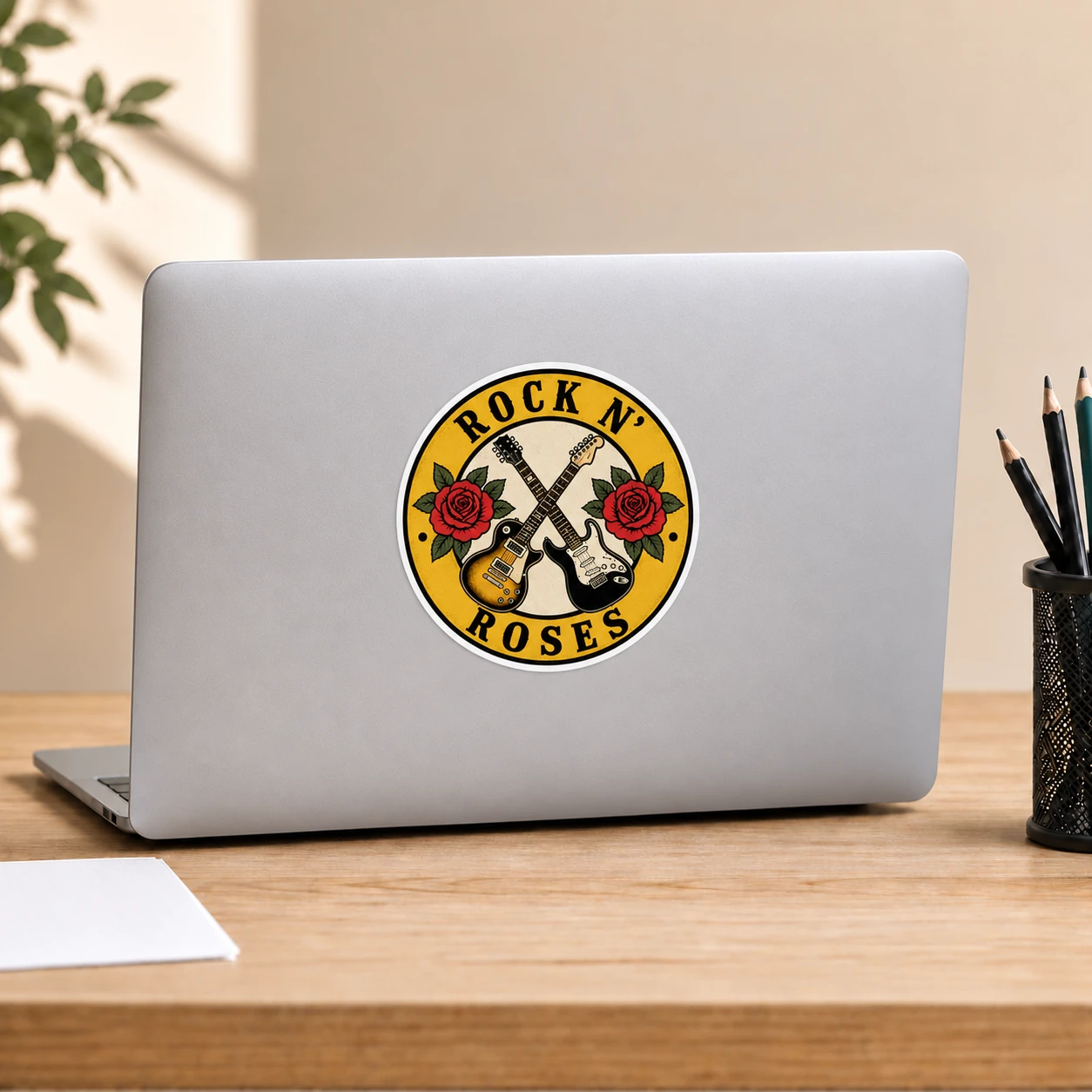 Rock ’n’ Roses Sticker, Crossed Guitars design shown on a laptop lid