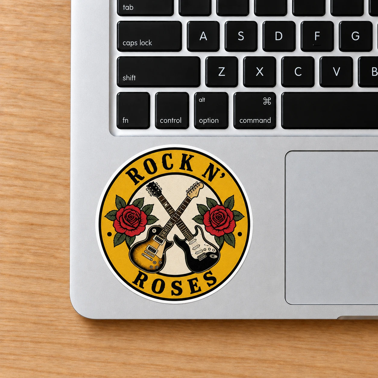 Rock ’n’ Roses Sticker, Crossed Guitars design shown on a laptop palm rest