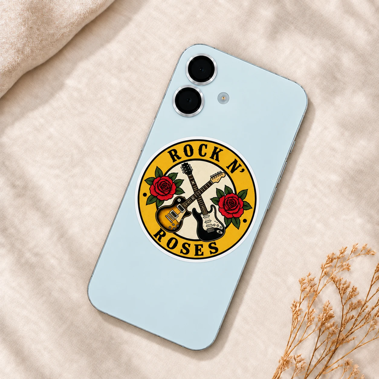 Rock ’n’ Roses Sticker, Crossed Guitars design shown on a phone