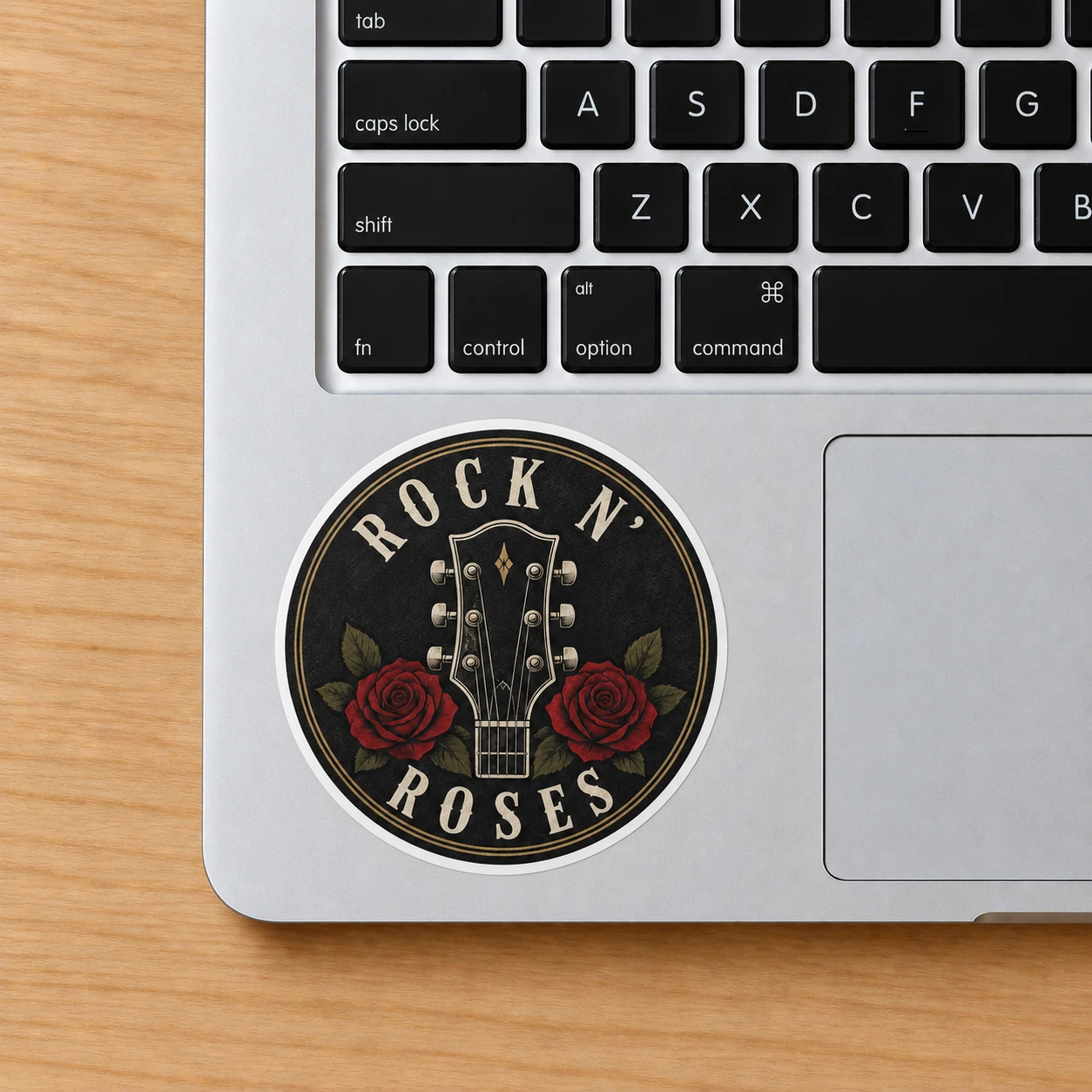 Rock ’n’ Roses Sticker, Rose Headstock design shown on a laptop palm rest
