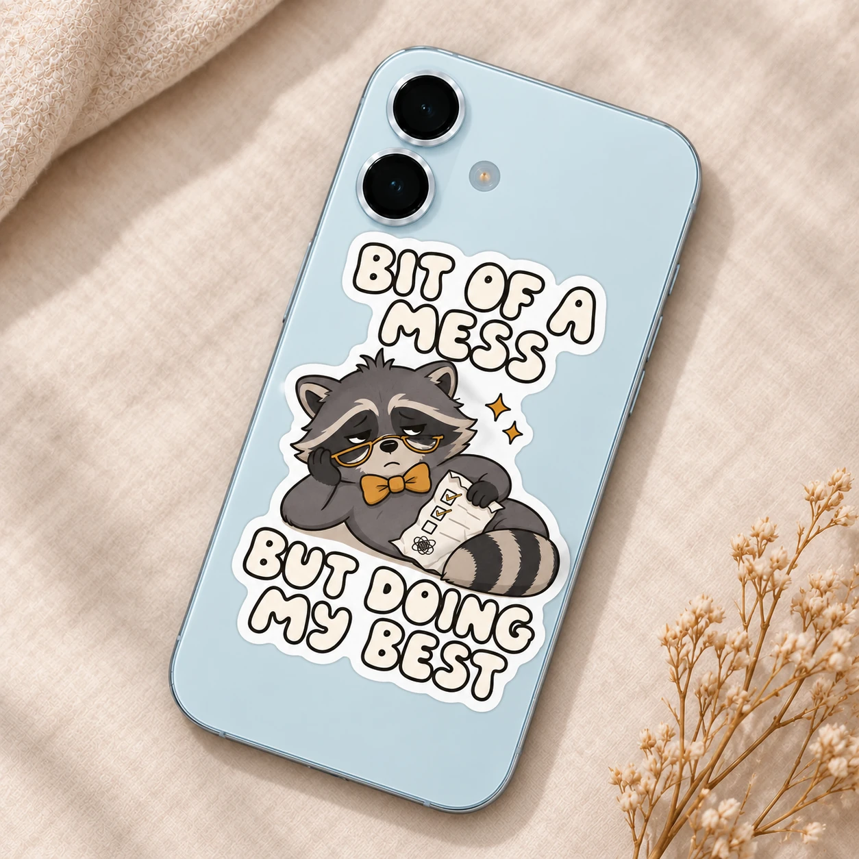 Bit of a Mess Sticker, Checklist Raccoon design shown on a phone
