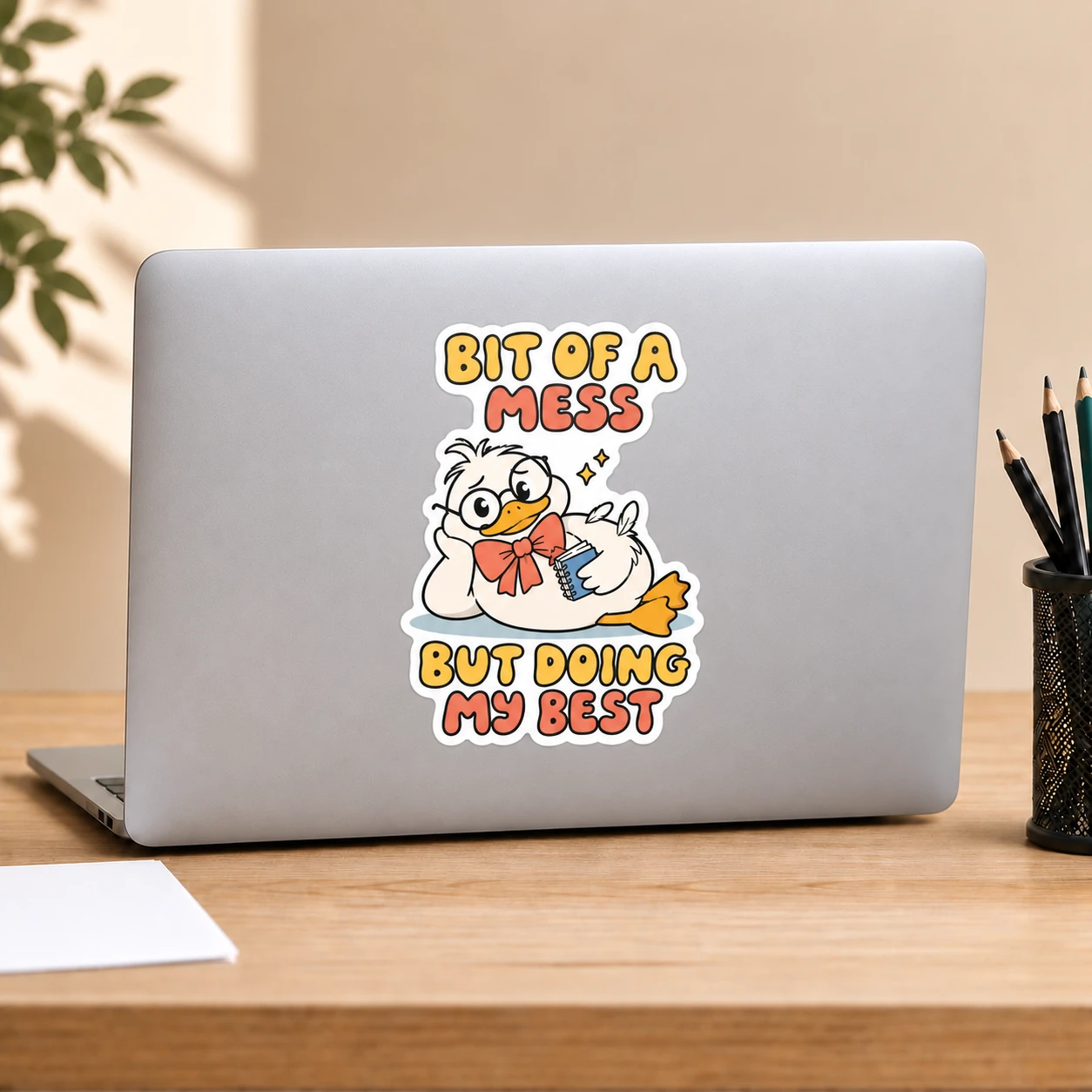 Bit of a Mess Sticker, Notebook Duck design shown on a laptop lid