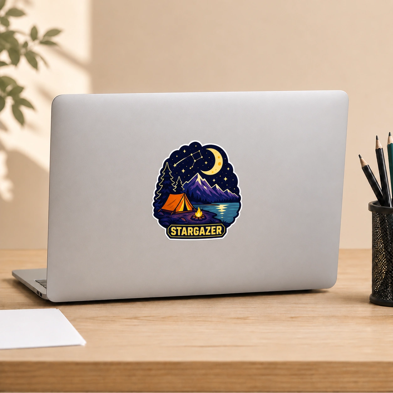 Starry Adventures Sticker, Stargazer design shown on a laptop lid