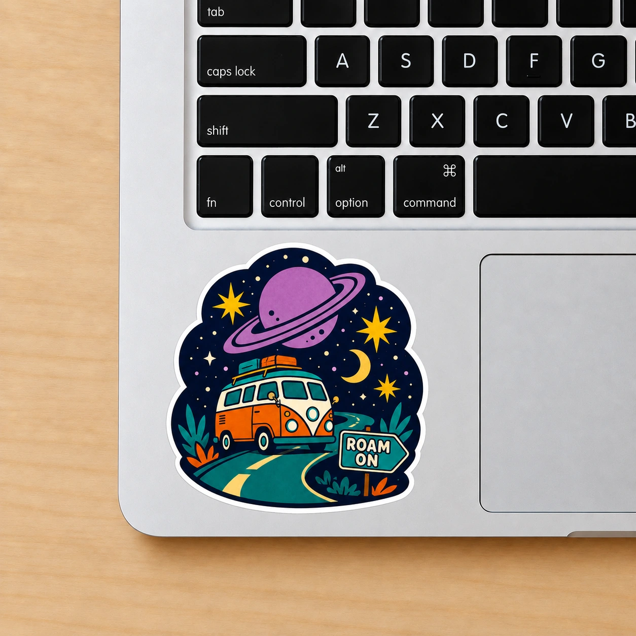 Starry Adventures Sticker, Roam On design shown on a laptop palm rest